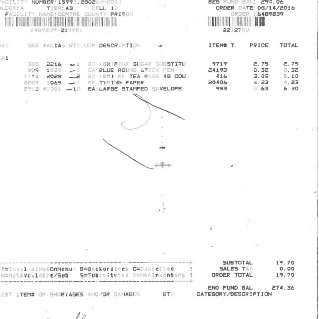 A printed purchase order receipt from Keefe Commissary Network Sales showing itemized orders for office supplies with totals and signatures.